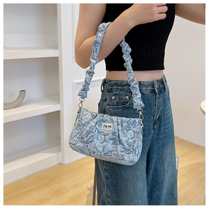 Close-up of light blue jacquard shoulder bag featuring a metal chain and JING PIN label