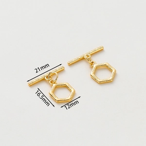 Detail view of gold-plated OT toggle clasp showing 21mm by 16.5mm size dimensions