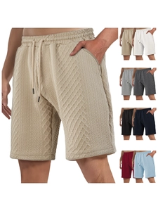 Detail of waffle textured fabric shorts with drawstring waistband and multi-color options