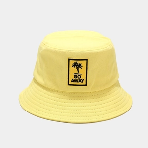Detail of yellow cotton bucket hat with Go Away palm tree embroidery and reinforced stitching