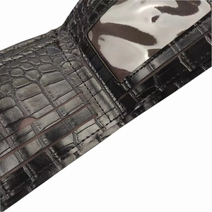 Close-up of crocodile pattern wallet interior with three card slots and one ID window