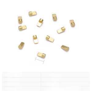 Macro detail of gold stainless steel charging pins with 1.4mm and 2.8x1.3mm dimensions