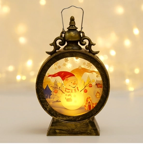 Detail of vintage bronze Christmas lantern with a warm glowing snowman scene inside