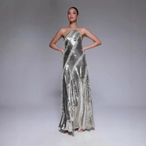 Elegant silver sequin halter evening gown with tiered ruffle hem for formal gala events