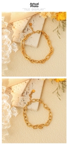 Detail of gold-plated stainless steel chain bracelet with smooth and textured links