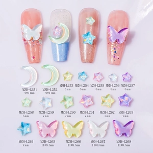Detail view of iridescent K9 glass moon and butterfly nail art rhinestones with dimensions