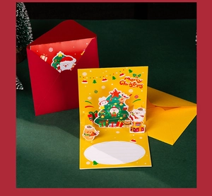 Detailed 3D Christmas pop-up card featuring Santa, reindeer, and cat with festive envelopes