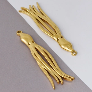 Detailed macro view showing two gold octopus ocean pendants made of 304 stainless steel
