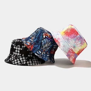 American retro double-sided bucket hats with floral, palm, and houndstooth prints