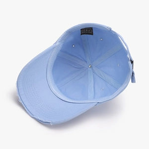 Sky blue distressed baseball cap in 100% cotton showing inner structure and frayed brim