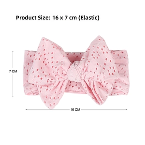 Detailed view of pink eyelet fabric baby headband with a large bow showing 16x7cm size