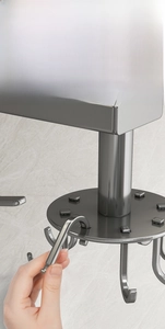 Detail showing detachable J-shaped hooks on a rotating stainless steel kitchen rack
