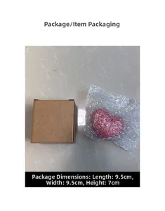 Pink heart-shaped ceramic candle holder in a cardboard box with dimensions shown