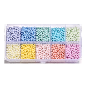 Detail view of 10-compartment storage box with assorted macaron colorful glass seed beads