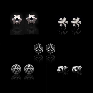 Set of five punk style silver geometric stud earrings featuring cross and star designs
