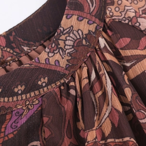 Bohemian paisley print maxi dress featuring a deep V-neck and soft chiffon fabric texture