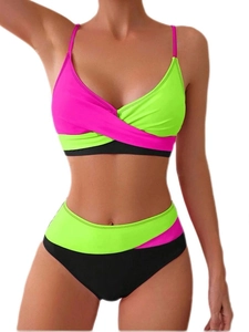 Detail view of two-piece bikini with neon green and pink color-block and crossover V-neck