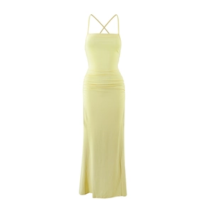 Detail shot of the backless cross strap design and ruching on this yellow maxi dress