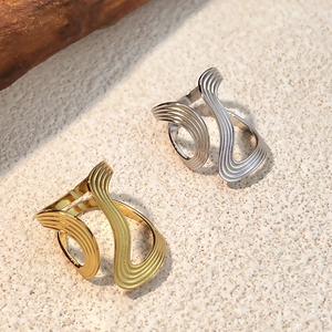 Minimalist irregular wave rings in gold and silver finish with liquid metal texture