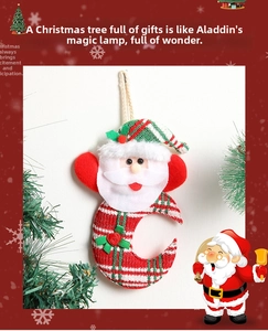 Detail of Santa Claus moon hanger made of plaid fabric and plush for Christmas decor
