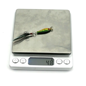 Mini metal jig lure 4.8g with green gradient finish and feathered treble hook