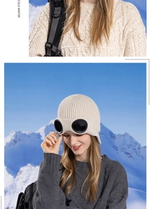 Detail of winter fleece-lined knit beanie with integrated pilot goggles and ear flaps