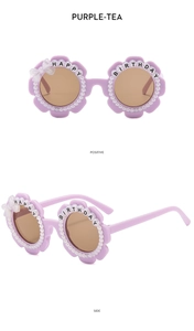 Detailed view of flower-shaped party sunglasses with pearls and bow on purple frames