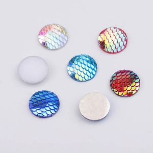 Macro view of 20mm AB resin mermaid scale cabochons with flat back for DIY jewelry making