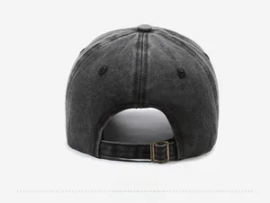 Detail of adjustable metal buckle and washed distressed texture on a baseball cap back