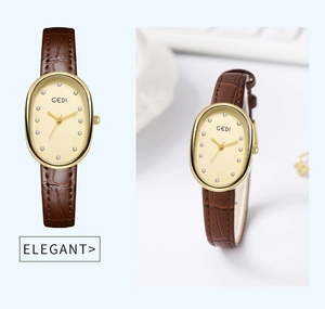 Detail of GEDI oval gold quartz watch with pearl dial and brown leather strap