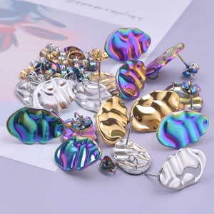 Close-up of wavy 304 stainless steel earrings in gold, silver, and rainbow colors