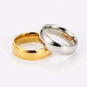 Polished stainless steel wide band rings in gold and silver finish with geometric design