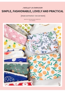 Detailed view of various cute floral and animal prints on canvas zip coin purses