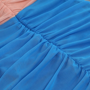 Detailed macro shot of royal blue and pink mesh fabric with fine pleated ruching textures
