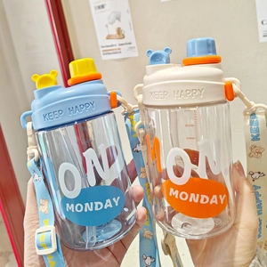Close-up of cute children's water bottles with dual drinking lids and colorful straps