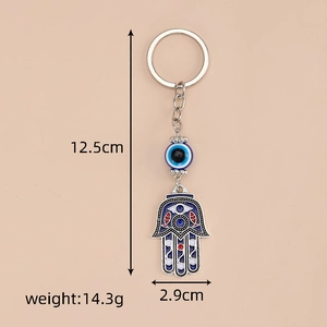 Detail view of ethnic Hamsa hand keychain with evil eye showing 12.5cm size and weight