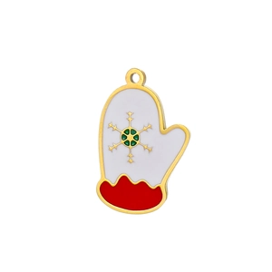 Macro shot of a Christmas glove charm in gold metal and enamel with a snowflake pattern