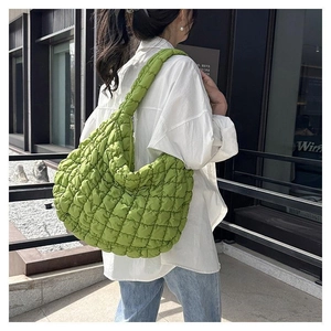 Quilted bubble tote bag in bright green featuring puffy texture and large capacity style