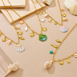 Golden stainless steel ocean theme necklaces with starfish and turtle enamel pendants