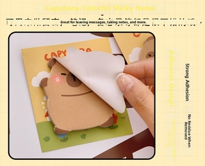 Close-up of cute Capybara shaped sticky notes being peeled from a warm grid background