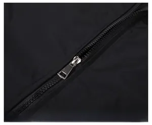 Close-up of the high-quality metal zipper and durable fabric of the black jacket