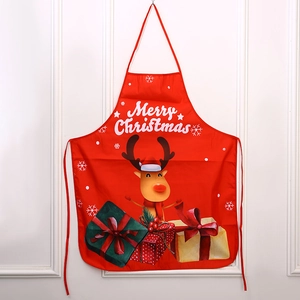 Detail of red Christmas apron with Merry Christmas text and cartoon reindeer print