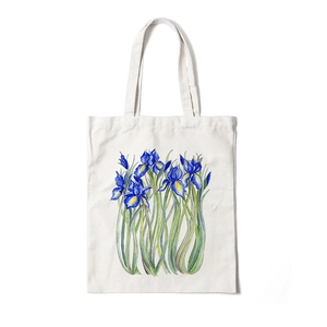 Floral canvas tote bag featuring blue iris aesthetic print on off-white background