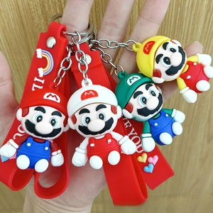 Detail of Mario and Luigi cartoon keychains with red silicone straps and metal rings