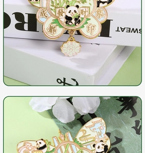 Close-up of metal panda bookmarks with colorful enamel and traditional Chinese lucky charms