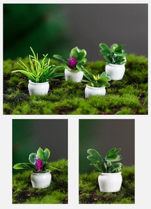 Macro detail of miniature dollhouse plants with white pots and colorful resin flowers