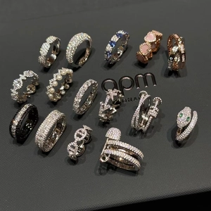 Assorted gold-plated zircon rings collection featuring snake, heart, and pearl designs