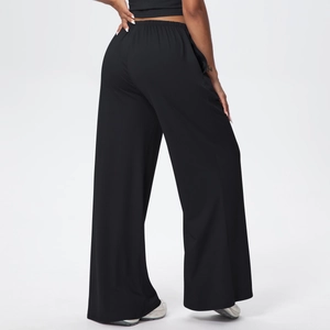 Detail of high waisted wide leg black lounge pants with elastic waistband and drape effect