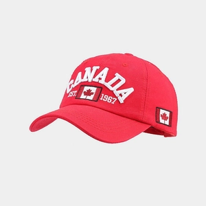 Close-up of red cotton baseball cap with premium Canada flag embroidery and text detail