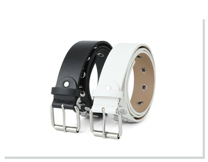 Detail view of black and white punk leather belts with metal star rivets and square buckles